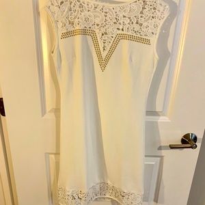 White dress with embellished neckline and lace